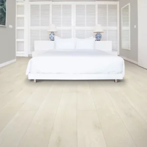 light colored laminate flooring in a bedroom | Petersen's Carpet & Flooring