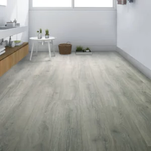 Gray laminate flooring in living space | Petersen's Carpet & Flooring