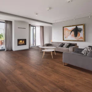 Warm neutral wood-look laminate flooring in living room | Petersen's Carpet & Flooring