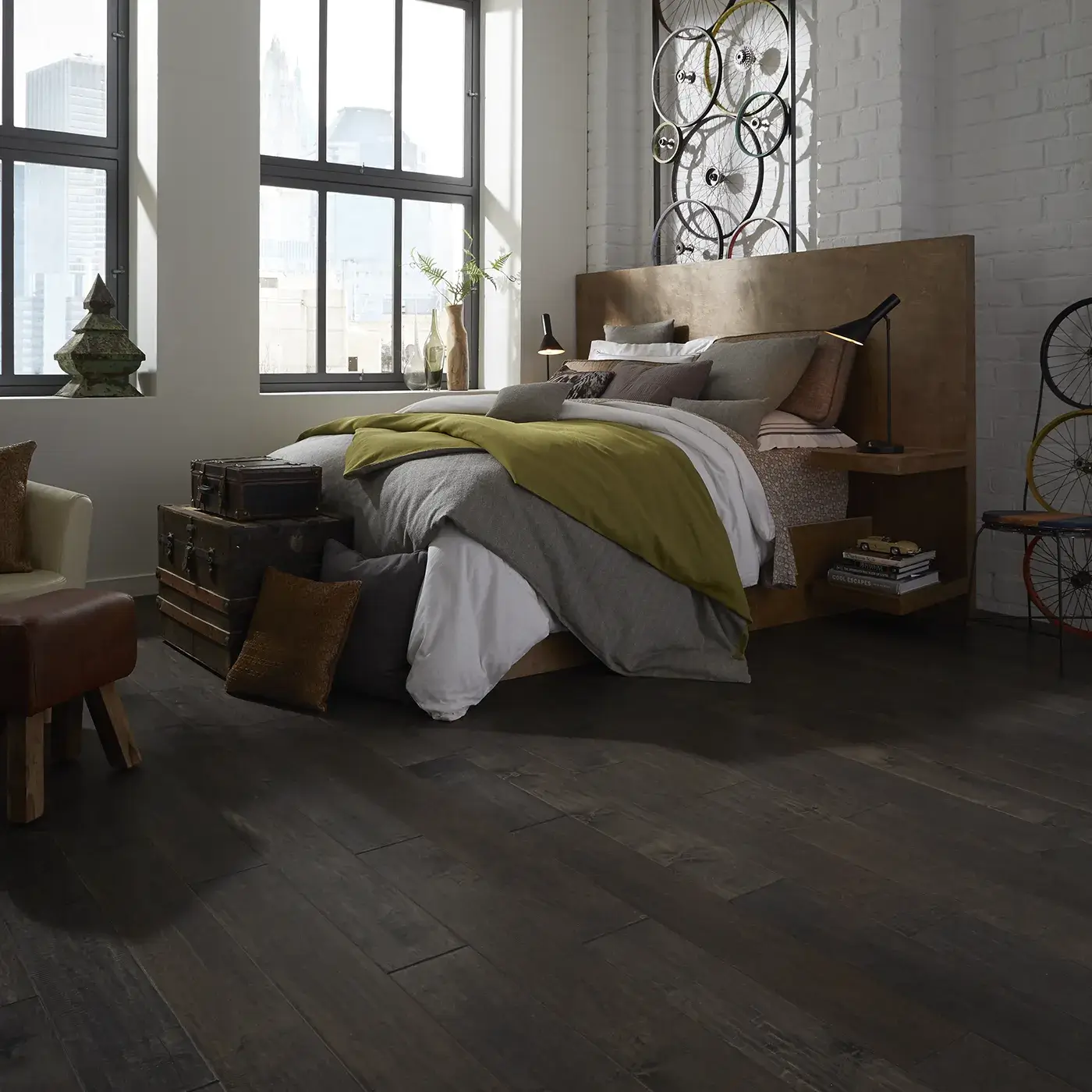 YukonMapleII-SW548-05002-Timberwolf-BedRm Dark hardwood in a modern bedroom with a large bed | Petersen's Carpet and Flooring
